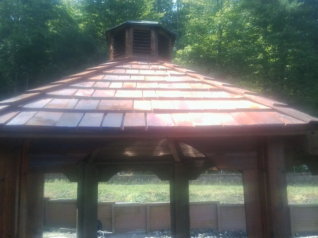 New cedar shake roof and cupola on a lakeside gazebo in Parksville